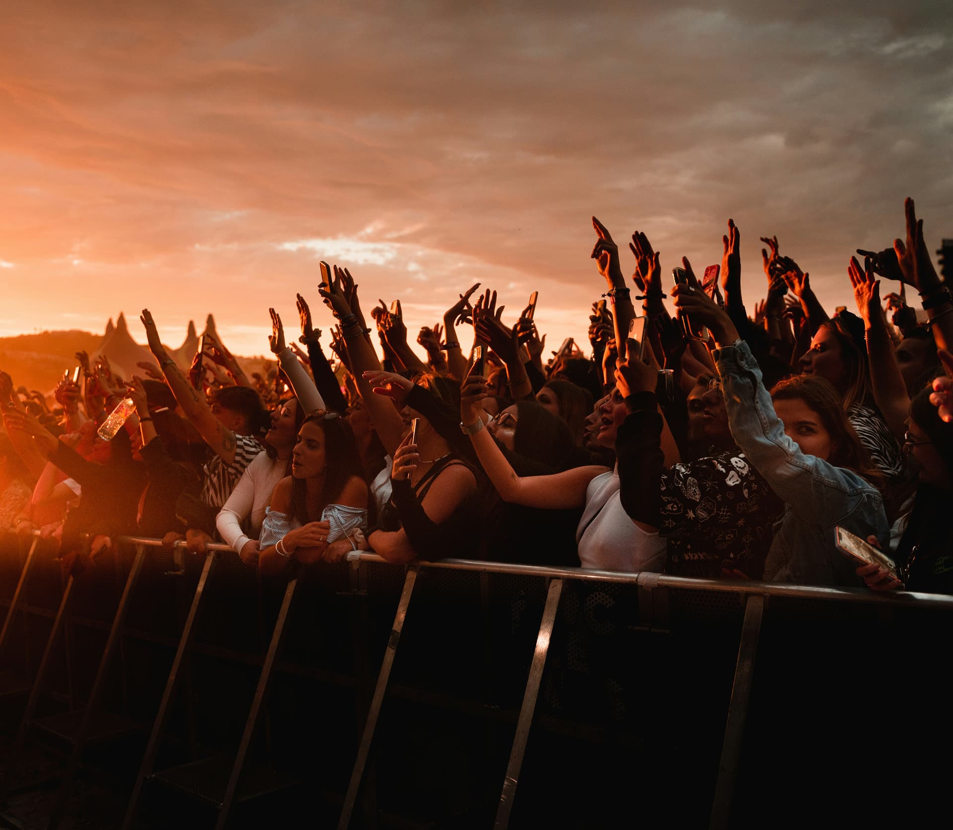 crowd in a music festival with red light