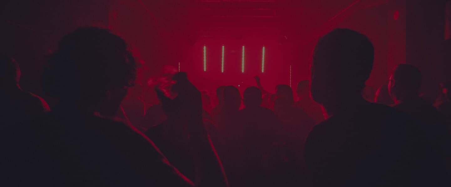 crowd in concert with red light