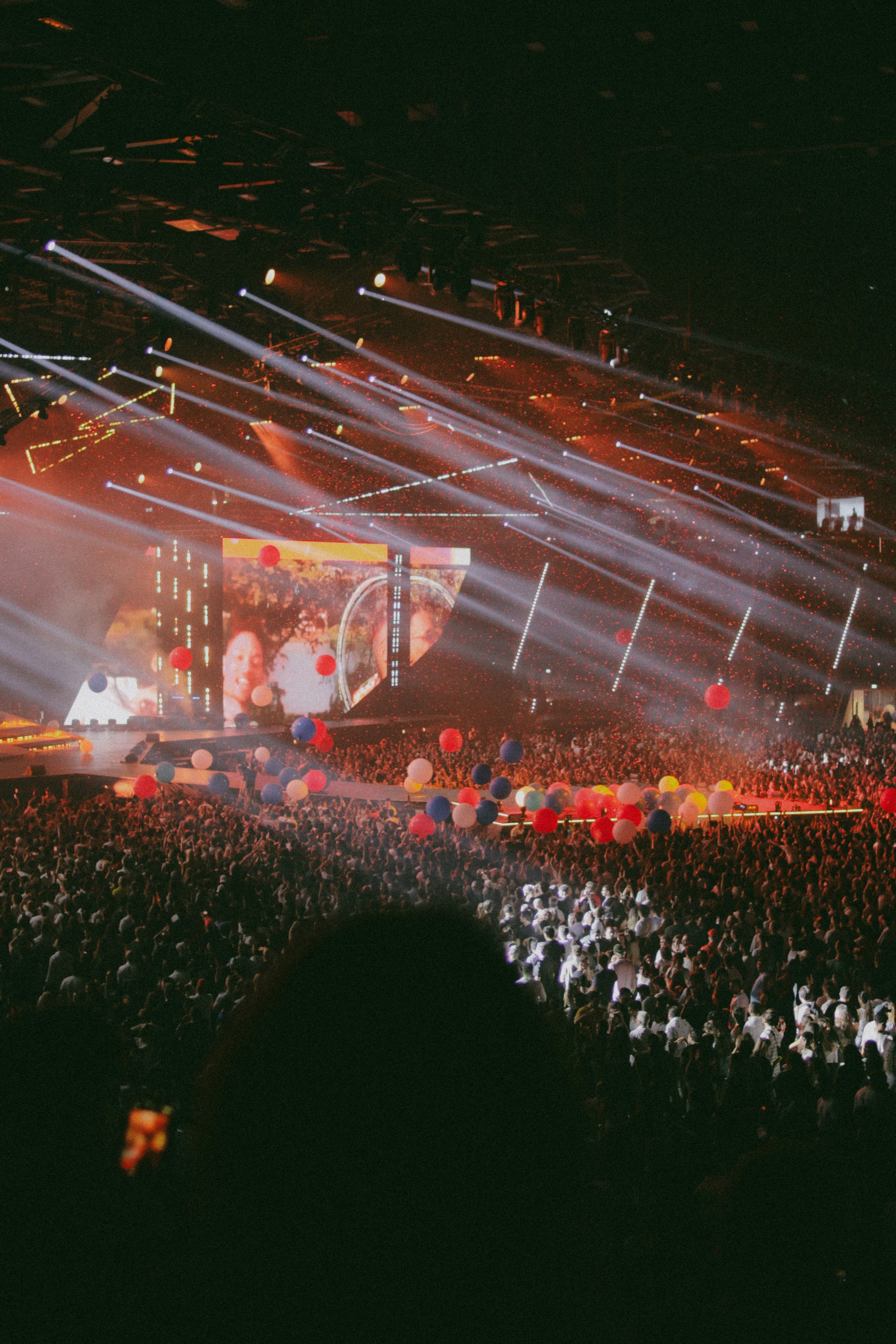 crowd in a music festival with yellow light